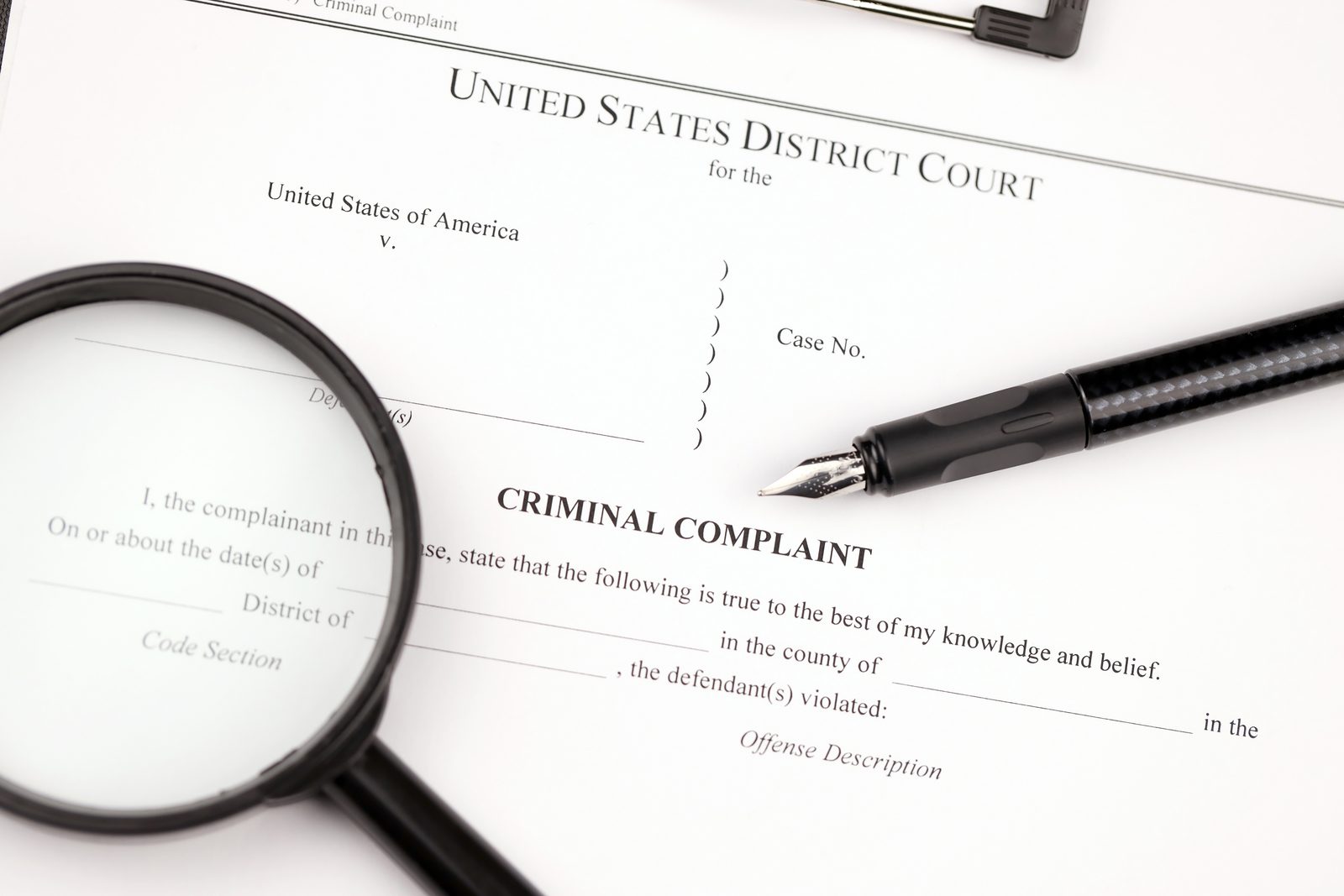 Legal papers laid out on a desk, ready to be hand delivered by a Michigan process server
